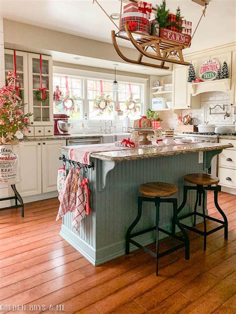 Holiday kitchens - Farmhouse Christmas Kitchen. Jay Wilde. It doesn't take a lot of décor to add a little Christmas cheer to the kitchen. Adorn cabinets or a pantry door with a wreath (or two) hung from a ribbon. Add a small Christmas tree or a few ceramic statues to open shelves for a subtle nod to the holidays. 06 of 17.
